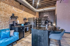 This open, one room loft features 12-foot ceilings and lots of room!