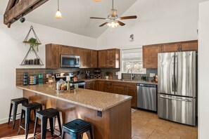 Fully equipped kitchen with coffee bar.
