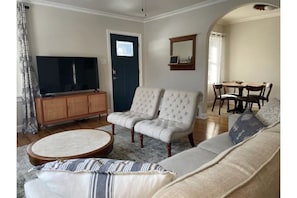 Comfortable living room with lots of sun and 60" TV