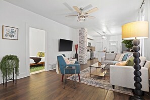 Living room off main entrance door. Open concept which is great for groups to mingle without feeling crammed.