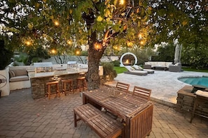 The backyard is magical. one of many patios to relax at.