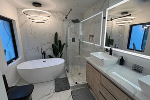 Relax in the tub or enjoy a hot shower in the master bath