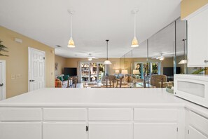 Fully Stocked Kitchen with Island Bar Seating