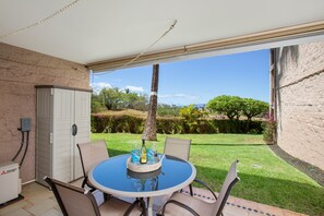 Your spacious balcony with dining table and 4 chairs.
