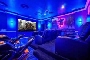 Indulge in the ultimate cinematic experience in our cozy theater room, complete with plush seating designed for unforgettable movie nights.