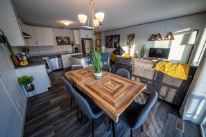 Dining table with seating for up to 6 people. Open concept living at its best!