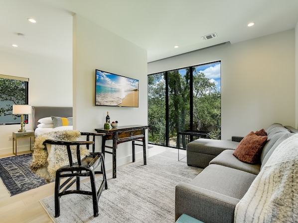 Living Room with Queen Sleeper Sofa + Smart TV