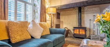 Mulberry Cottage, Holt: Cosy sitting room with Inglenook fireplace