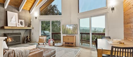 Floor-to-ceiling glass sliding door in the living area