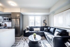Modern bright multi-functional living room & kitchen. 