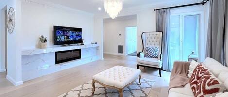 Lounge with comfy sofa and large Smart TV