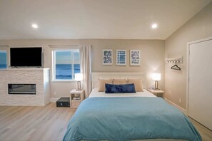 Cozy fireplace and ocean views from the bed