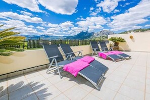 The South Facing Balcony With Views Over the Private Pool and Mountains.