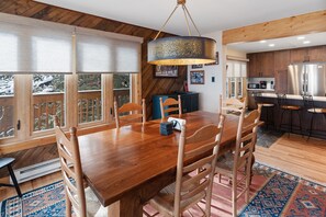 Dining Room - Another view of the dining room with kitchen in the background.