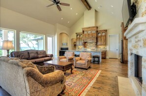 Picture windows line the back with scenic views from the kitchen and great room