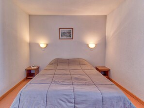 Cozy single retreat with soft lighting for a peaceful night's rest.