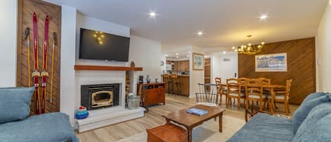 Open floor plan with wood burning fireplace