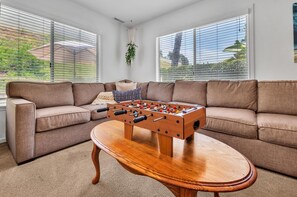Downstairs living room with smart TV and plenty of seating