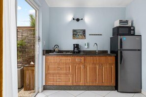 Full-size fridge, toaster oven, microwave, coffee maker and kettle as well as all the dishes, cutlery, pots and pans you might need.