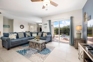 In the living room, you can watch your favorite shows or simply relax on the sofa.