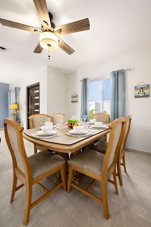 A dining area with seating for 6 to enjoy a delicious meal.