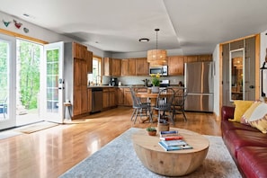 Open concept living, dining, and kitchen areas.