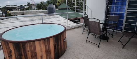 Terrace with private Jacuzzi and outdoor furniture