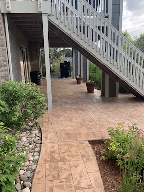 front of the basement entrance where guests enter