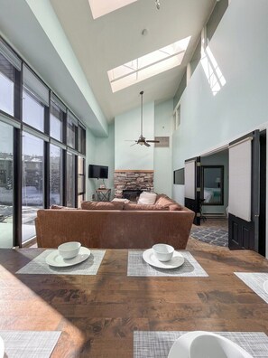 Dine with a view in this bright, airy dining area. You will love starting your day here, with sunlight streaming through the large windows, setting a perfect tone for your morning coffee or a cozy dinner with loved ones.