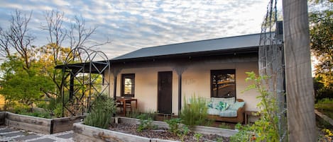 exterior of cottage with veg garden in the foreground