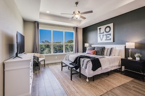 Master bedroom with a king size bed