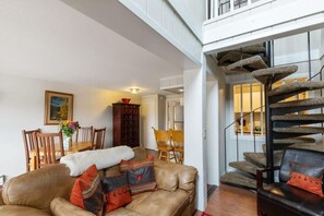 Spiral staircase leads to the second floor and loft