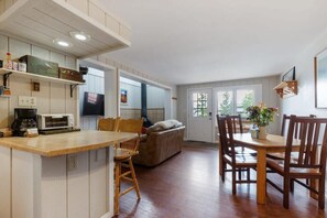 Living room, dining room and kitchen share an open space