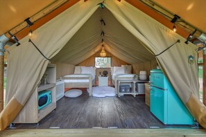 Living quarters featuring a microwave and retro style fridge