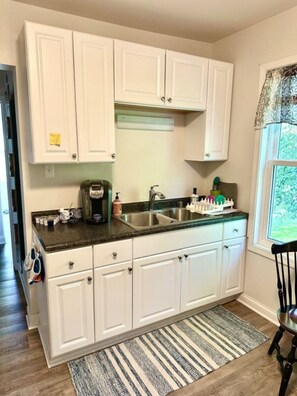 A Keurig coffee maker and coffee pods are here for you, and a Graco high chair (not pictured) is also available.