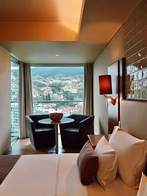 2 chairs and tables with mountain view.