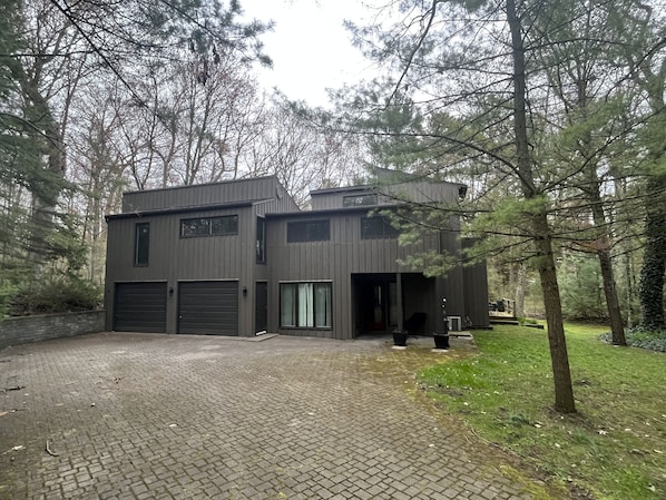 Front of cottage in early spring. Easy parking for two, or more if in tandem