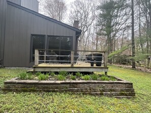 Side deck off living room, lovely spot for chatting with a coffee