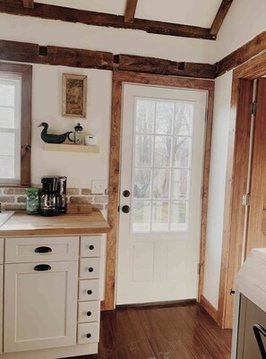 Door to the back deck. Bathroom to the right.