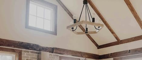 Our sun-filled kitchen stocked with basic cooking supplies. Original wood beams.