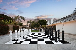 Checkmate! Feeling like a master strategist - a human-sized chess set on our property!