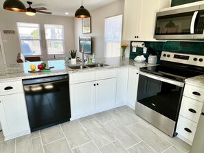 Full kitchen with cooking essentials.