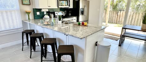 Full kitchen with cooking essentials.
