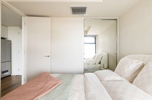 The bedroom has separate air-conditioning and luxe linens.