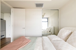 The bedroom has separate air-conditioning and luxe linens.