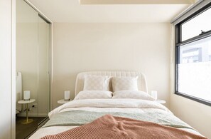 Deliciously, cozy and luxe Queen tufted bed. Built in robes and masses of light.