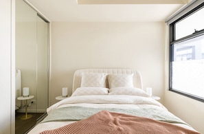 Deliciously, cozy and luxe Queen tufted bed. Built in robes and masses of light.