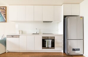 Gorgeous galley kitchen with large fridge/freezer, dishwasher and microwave.
