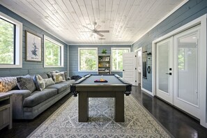 Game Room: Enjoy friendly competition at the sleek pool table surrounded by nature's charm!