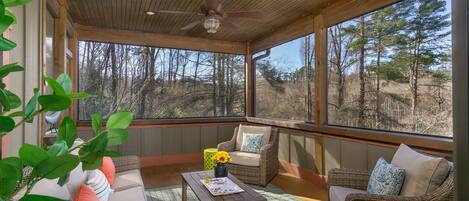 Screened in porch with outdoor furniture to relax & enjoy the fresh mountain air